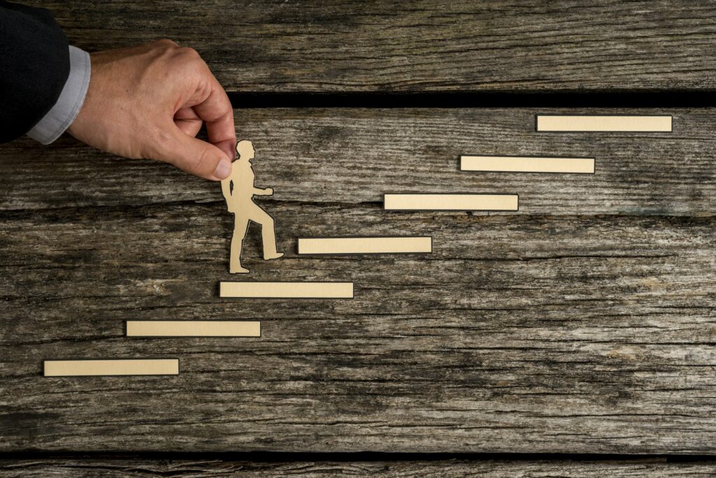 Businessman climbing the steps to success